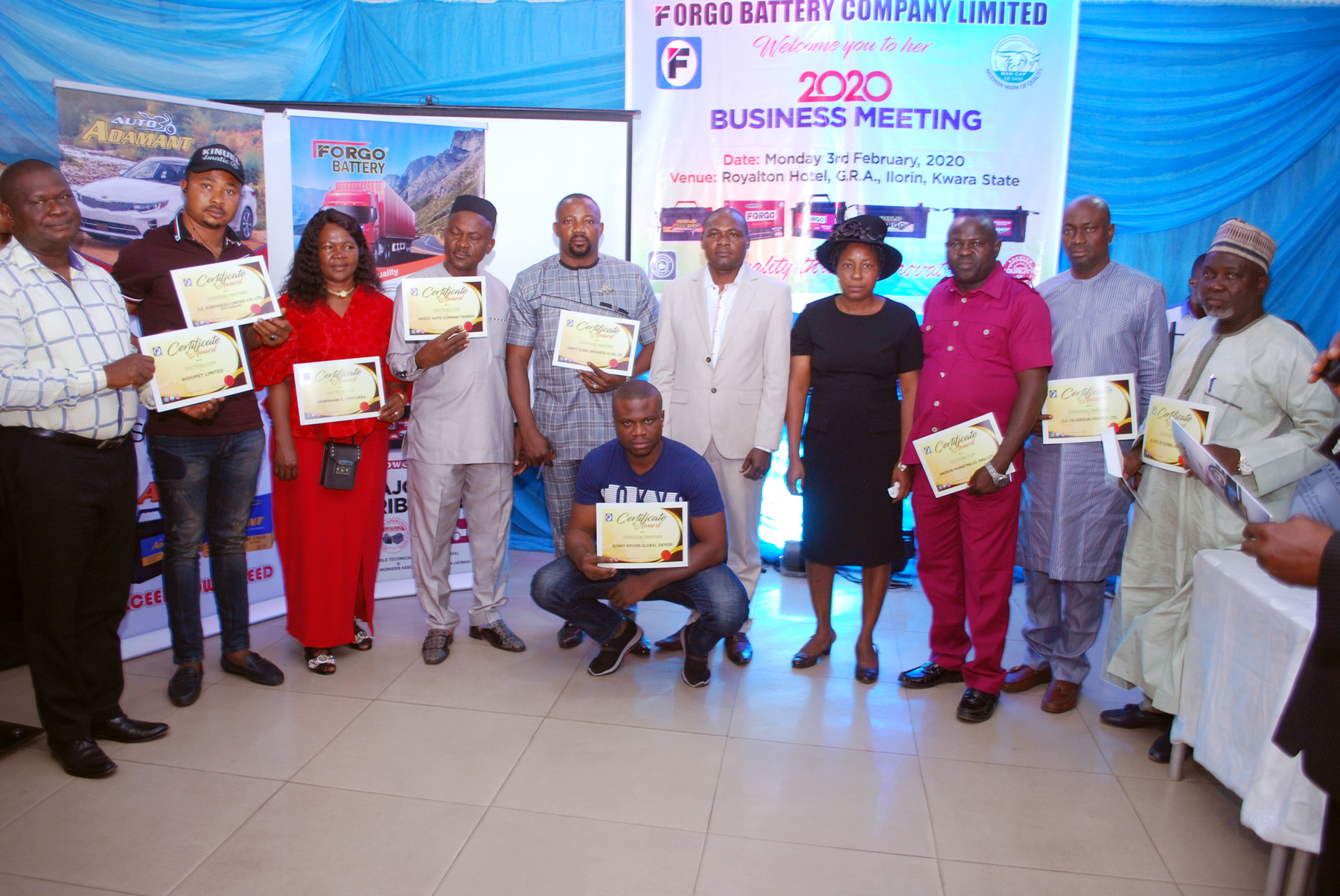 The MD and his wife in a group photograph with some of our distributors