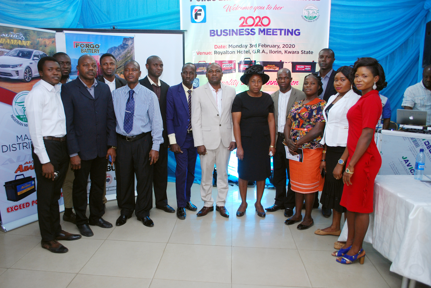 The MD and his beloved wife in a group photograph with some members of staff at the Business Meeting